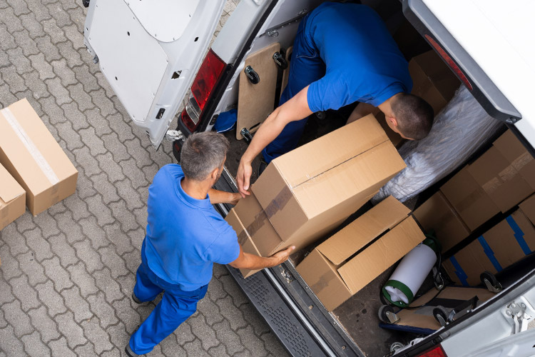 Professional Movers Are Loading a Moving Van