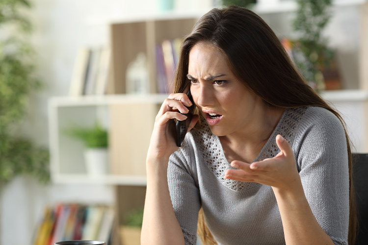An Angry Woman Is Arguing Over The Phone